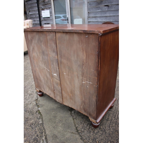 483 - A Victorian flame figured mahogany chest of four long graduated drawers with turned ebony and knobs ... 