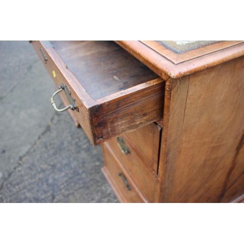 488 - A 19th century figured walnut and banded kneehole desk with tooled lined top, fitted two wide drawer... 