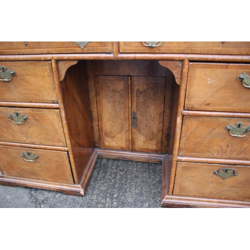 488 - A 19th century figured walnut and banded kneehole desk with tooled lined top, fitted two wide drawer... 