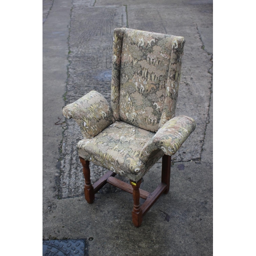 494 - A child's oak armchair of early 17th century design, upholstered in a Jacquard figured tapestry, on ... 