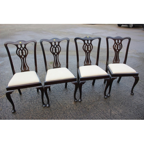 505 - A set of four 19th century mahogany pierced splat back dining chairs with drop-in seats, on cabriole... 