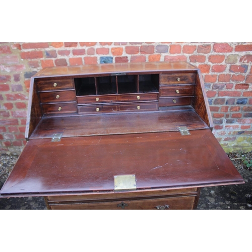 515 - A Georgian mahogany and vase inlaid fall front bureau with fitted interior over four long graduated ... 