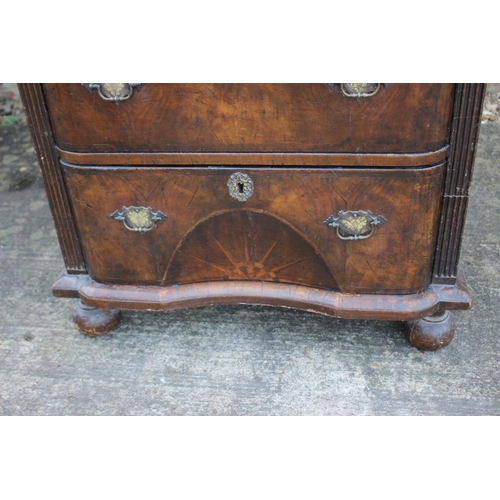 516 - A bachelor's early Georgian figured walnut and feather banded break bowfront chest of three long dra... 