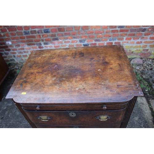 516 - A bachelor's early Georgian figured walnut and feather banded break bowfront chest of three long dra... 