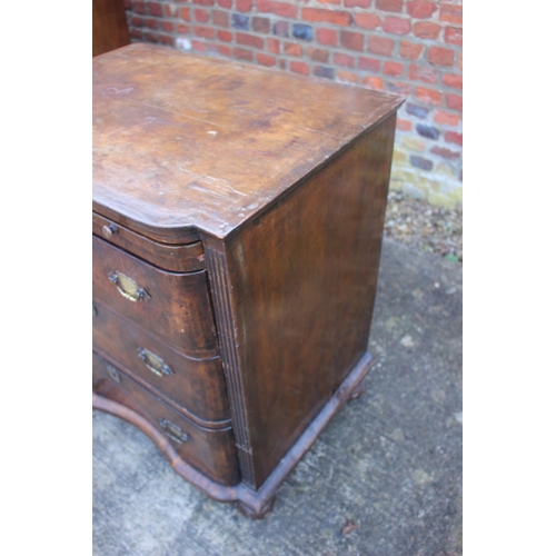 516 - A bachelor's early Georgian figured walnut and feather banded break bowfront chest of three long dra... 