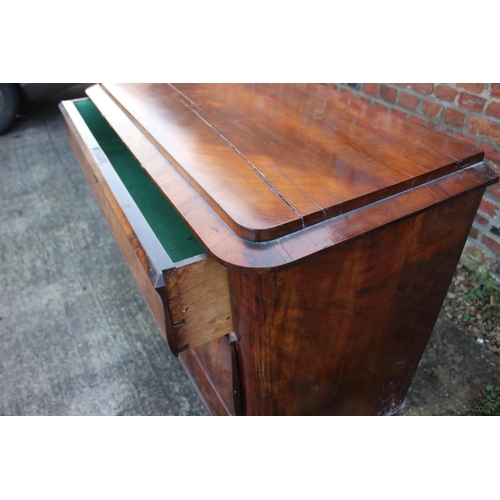 517 - A 19th century Continental figured mahogany commode chest of three drawers with shaped fronts, on br... 