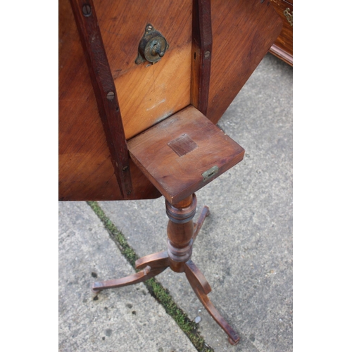 521 - A William IV walnut square tilt top occasional table, on turned column and tripod splay support, 18