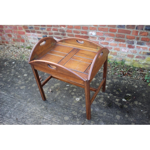 523 - A butler's mahogany folding tray, on stand, 20