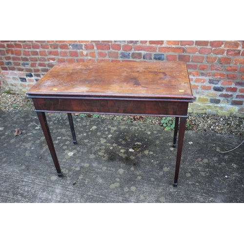 526 - A 19th century mahogany fold over top card table, on square taper supports, 36