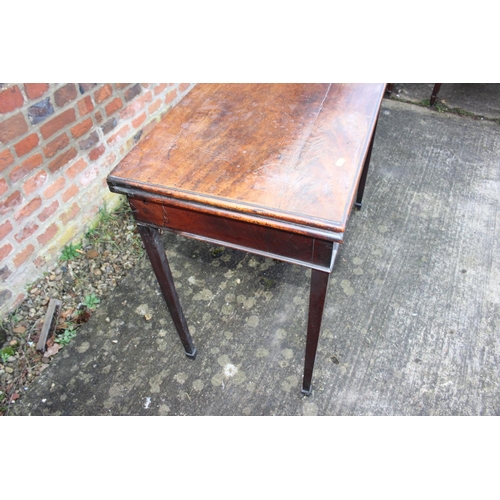 526 - A 19th century mahogany fold over top card table, on square taper supports, 36