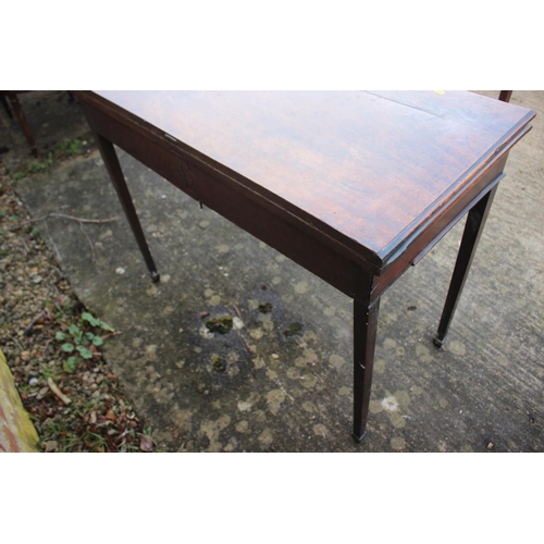 526 - A 19th century mahogany fold over top card table, on square taper supports, 36