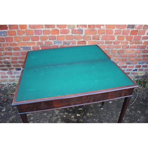 526 - A 19th century mahogany fold over top card table, on square taper supports, 36