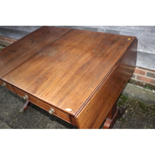 528 - A 19th century mahogany sofa table, fitted two drawers with brass knobs, on splay supports and brass... 