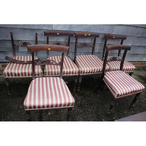 532 - A set of six early 19th century mahogany carved bar back dining chairs with stuffed over seats, on t... 