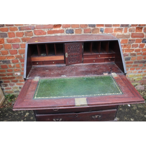 546 - A Georgian mahogany fall front bureau, the interior fitted drawers and pigeonholes over four long gr... 