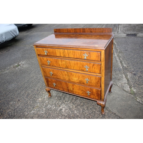 590 - A 1930s walnut chest of four long drawers, on cabriole supports, 36