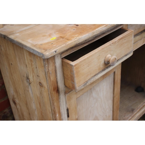 609 - A 19th century pine dresser with plate rack over two drawers and cupboards, on block base, 40 1/2