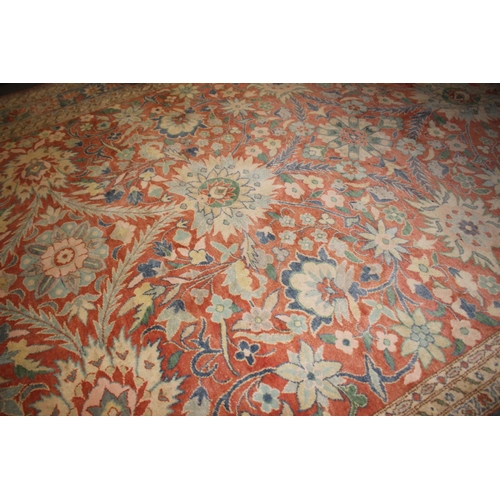 613 - An Egyptian Ziegler wool pile carpet with all-over floral design in shades of blue and cream on a ru... 