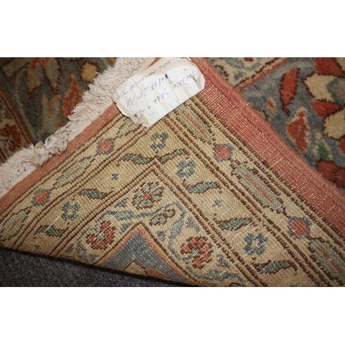 613 - An Egyptian Ziegler wool pile carpet with all-over floral design in shades of blue and cream on a ru... 