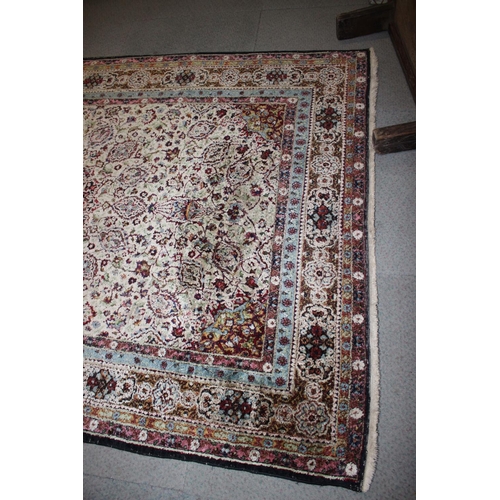 615 - An Isfahan silken pile rug with all-over floral figured design on a white ground and multi-borders i... 