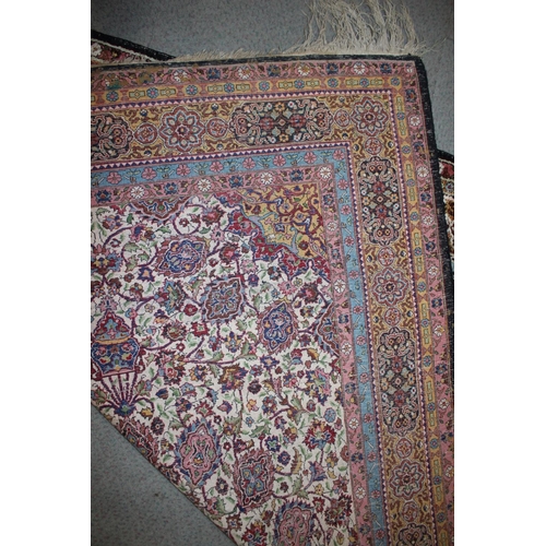 615 - An Isfahan silken pile rug with all-over floral figured design on a white ground and multi-borders i... 