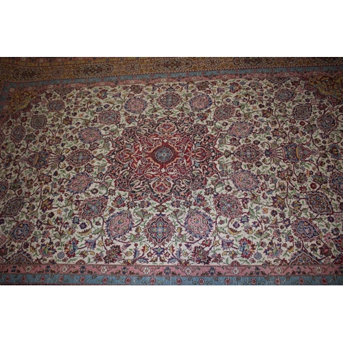 615 - An Isfahan silken pile rug with all-over floral figured design on a white ground and multi-borders i... 