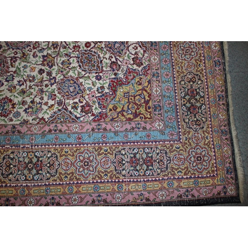 615 - An Isfahan silken pile rug with all-over floral figured design on a white ground and multi-borders i... 