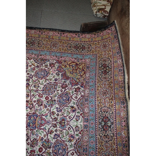 615 - An Isfahan silken pile rug with all-over floral figured design on a white ground and multi-borders i... 