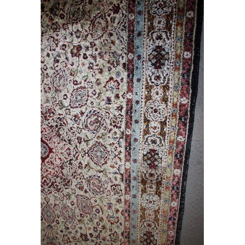 615 - An Isfahan silken pile rug with all-over floral figured design on a white ground and multi-borders i... 