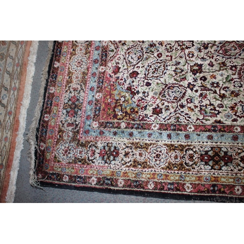 615 - An Isfahan silken pile rug with all-over floral figured design on a white ground and multi-borders i... 