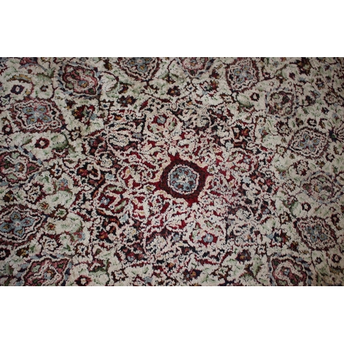 615 - An Isfahan silken pile rug with all-over floral figured design on a white ground and multi-borders i... 