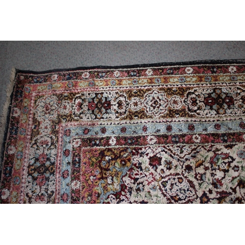 615 - An Isfahan silken pile rug with all-over floral figured design on a white ground and multi-borders i... 