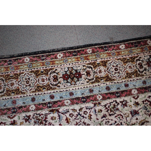 615 - An Isfahan silken pile rug with all-over floral figured design on a white ground and multi-borders i... 