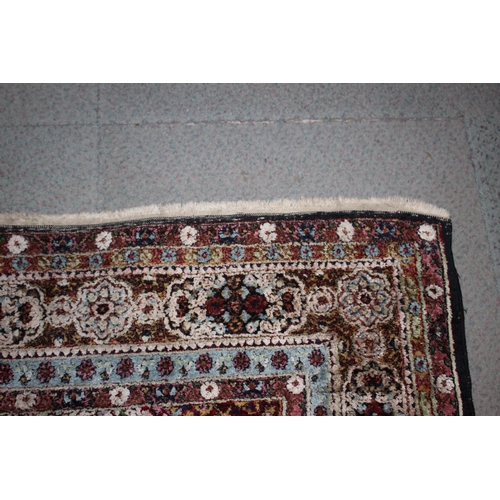 615 - An Isfahan silken pile rug with all-over floral figured design on a white ground and multi-borders i... 