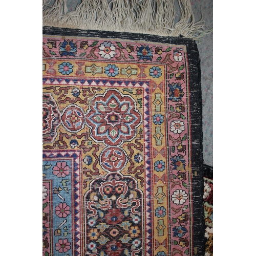 615 - An Isfahan silken pile rug with all-over floral figured design on a white ground and multi-borders i... 