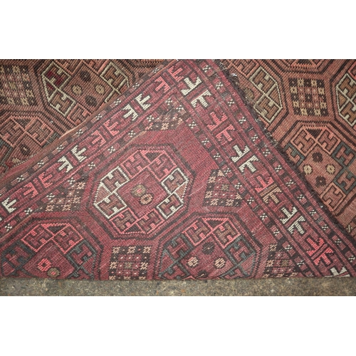 627 - A Bokhara type rug with all-over octagonal gul design, 74