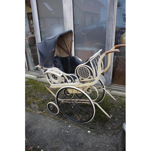 651 - An early 20th painted wood pram with adaptable wickerwork body and hood