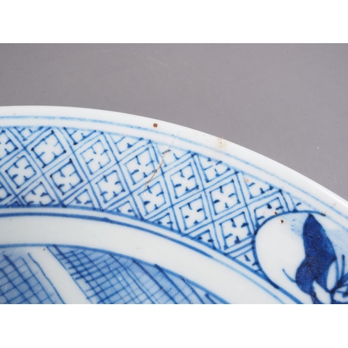 72 - A Chinese blue and white dish, decorated with figures by a house, 11 3/4