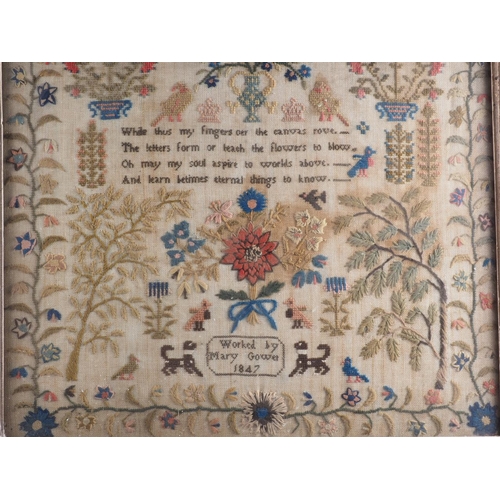 192 - A 19th century sampler with vase and flowers, worked by Mary Gower 1847, 18