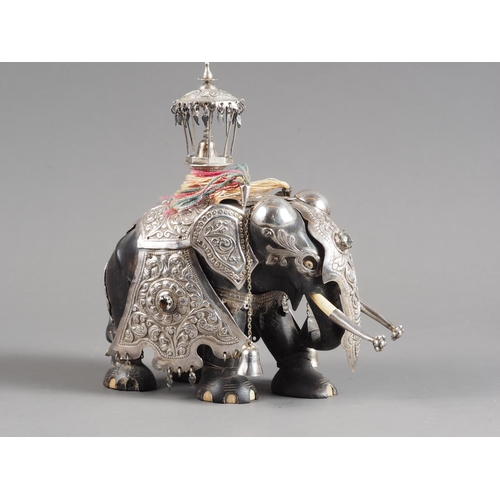 263 - A Sri Lankan white metal mounted, carved ebony and bone model elephant, 6 1/2