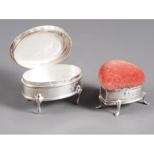 278 - An oval silver ring box with engraved lid and a heart-shaped silver pin cushion