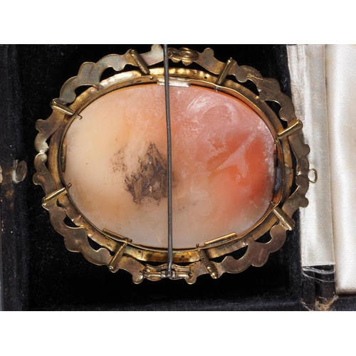 305 - A carved shell cameo, decorated two figures, in yellow metal frame