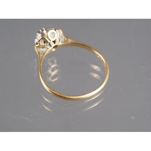 319 - An 18ct gold and diamond target ring, size N, 2.5g