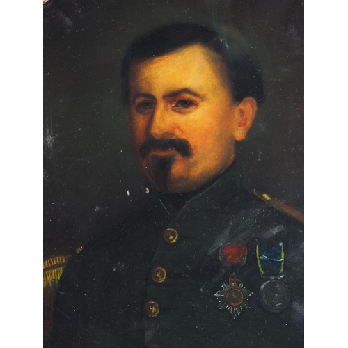 475 - A 19th century oil on canvas oval portrait of a Continental military officer, 29