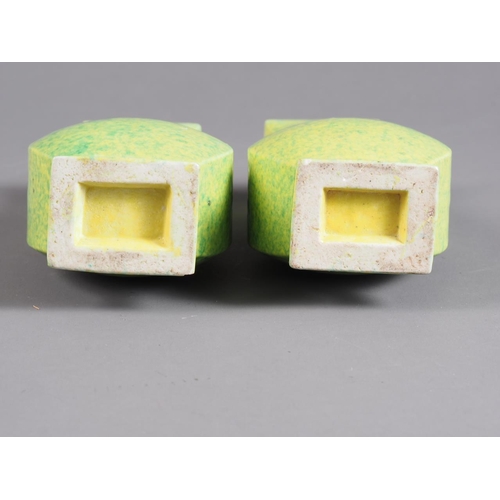 74 - A pair of Chinese green and yellow mottled glaze square-sectioned vases with mask and ring handles, ... 