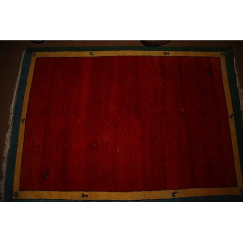 649 - A modern wool pile rug with red centre and yellow and blue bands, 95