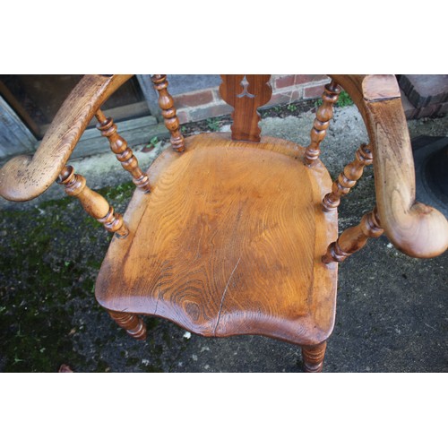 503 - A 19th Windsor spindle and fruitwood splat back elbow chair, on turned and stretchered supports