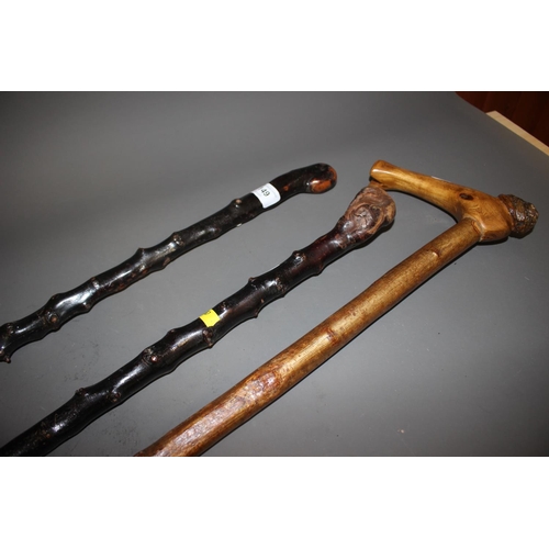 149 - Two blackthorn walking sticks and a hazel stick with burr elm handle