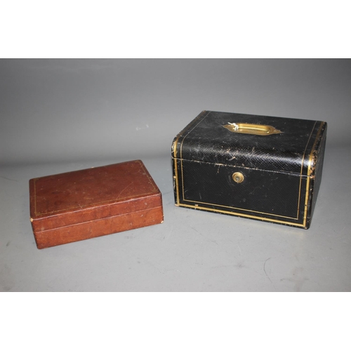 304 - A Morocco tooled and gilt leather jewellery box, and a leather clad cigar box