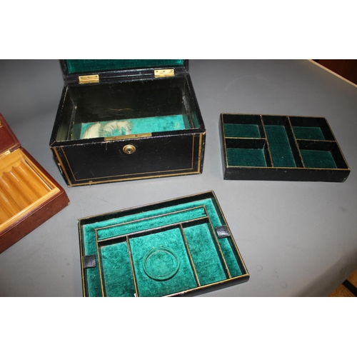 304 - A Morocco tooled and gilt leather jewellery box, and a leather clad cigar box